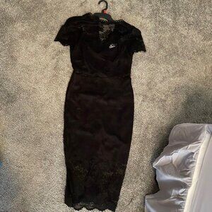 Black midi form fitting lace dress